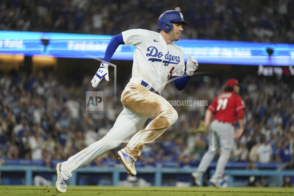 Los Angeles Dodgers' David Peralta (6) celebrates after doubling