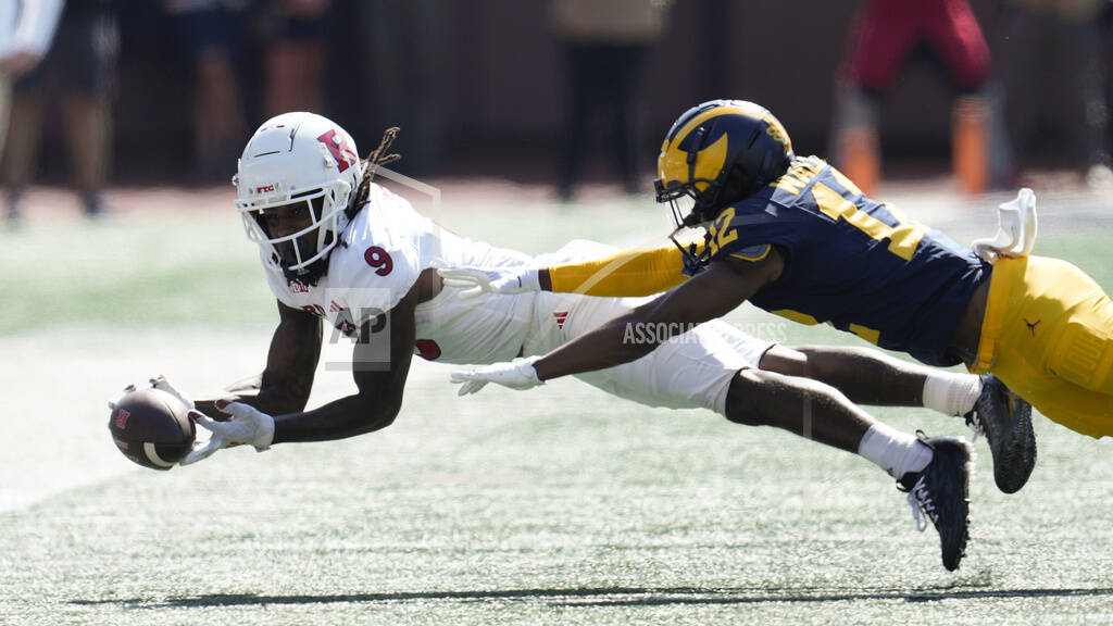 NCAA - Rutgers University Football: Two Lower Level Sideline