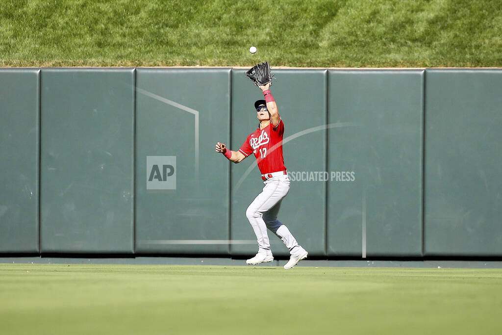 Cincinnati Reds' Stuart Fairchild stands in the dugout after his