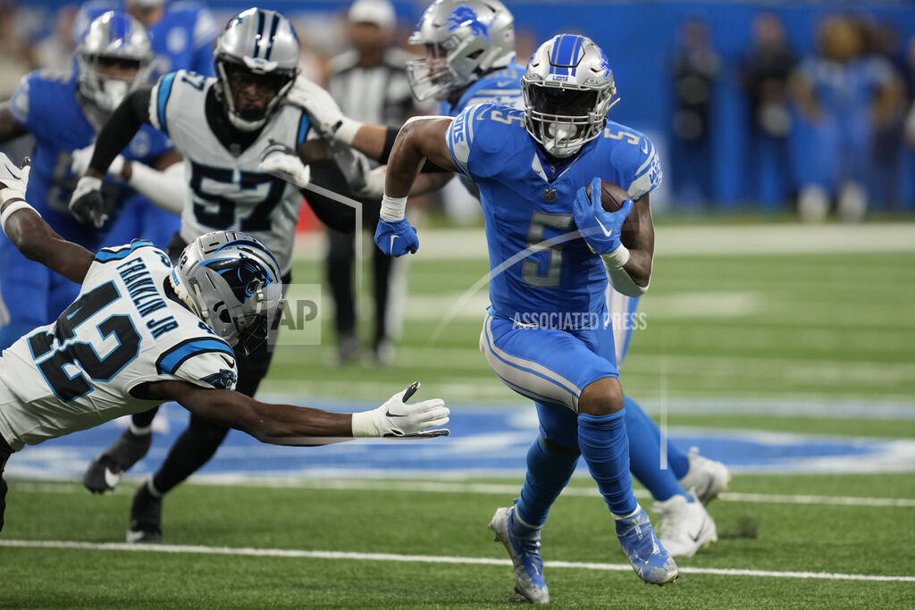 Detroit Lions running back Kevin Jones runs for yardage in the