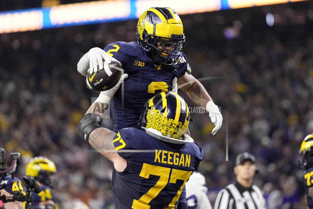 Corum scores 2 TDs Michigan overpowers Washington 34 13 Record